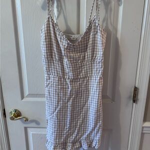 Abercrombie & Fitch gingham smocked mini dress in a tan/natural color.